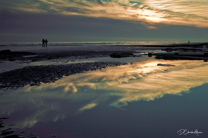 Bexhill Sunset 
 Low tide at Bexhill-on Sea, the golden skies are reflected in the rock pools. 
 Keywords: Bexhill, Bexhill-on-sea, sunset, low tide, Sussex landscape, photos of Sussex, photographs of Bexhill, reflections,