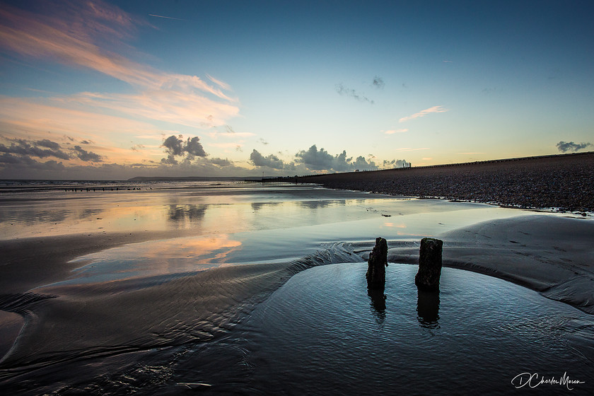 Low Tide 
 Low tide gives the sand and shallow pools a reflective quality as they pick up the subtle up-light of the setting sun. 
 Keywords: Low tide, rock pools, rockpools, sky reflection, colour, coastal scene, sussex, sussex coast,