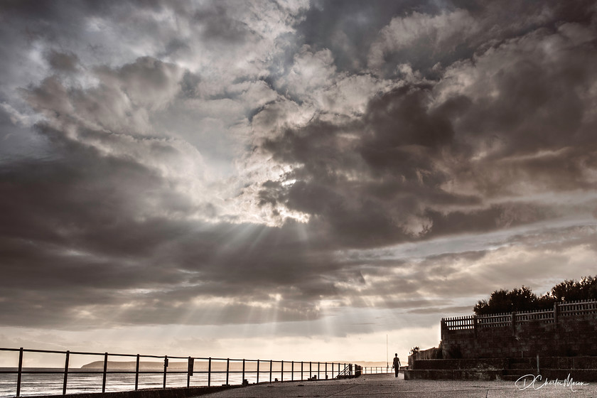 After the Storm 
 Known locally as the "Splashdeck" , the sun will be setting over Beachy Head as the sun rays break through after a cloud burst of rain. 
 Keywords: Bexhill, Bexhill on sea; Bexhill splashdeck, stormy sky, Sussex, Sussex landscape, Sussex coast, photographs of Sussex,